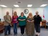 Our Village presented awards to three employees for being Mental Health Heroes in our schools.  