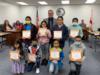 Migrant students were recognized for their participation in the summer camp, Camp Create where they created books and narrated the drawings.