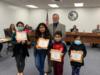 Migrant students were recognized for their participation in the summer camp, Camp Create where they created books and narrated the drawings.